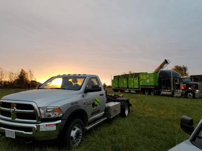 unloading dumpsters with roll off truck in toledo 